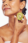 Skincare, beauty and senior woman with kiwi in studio isolated on a transparent png background. Food, fruit and natural model with nutrition for wellness, healthy diet and vitamin c for anti aging.