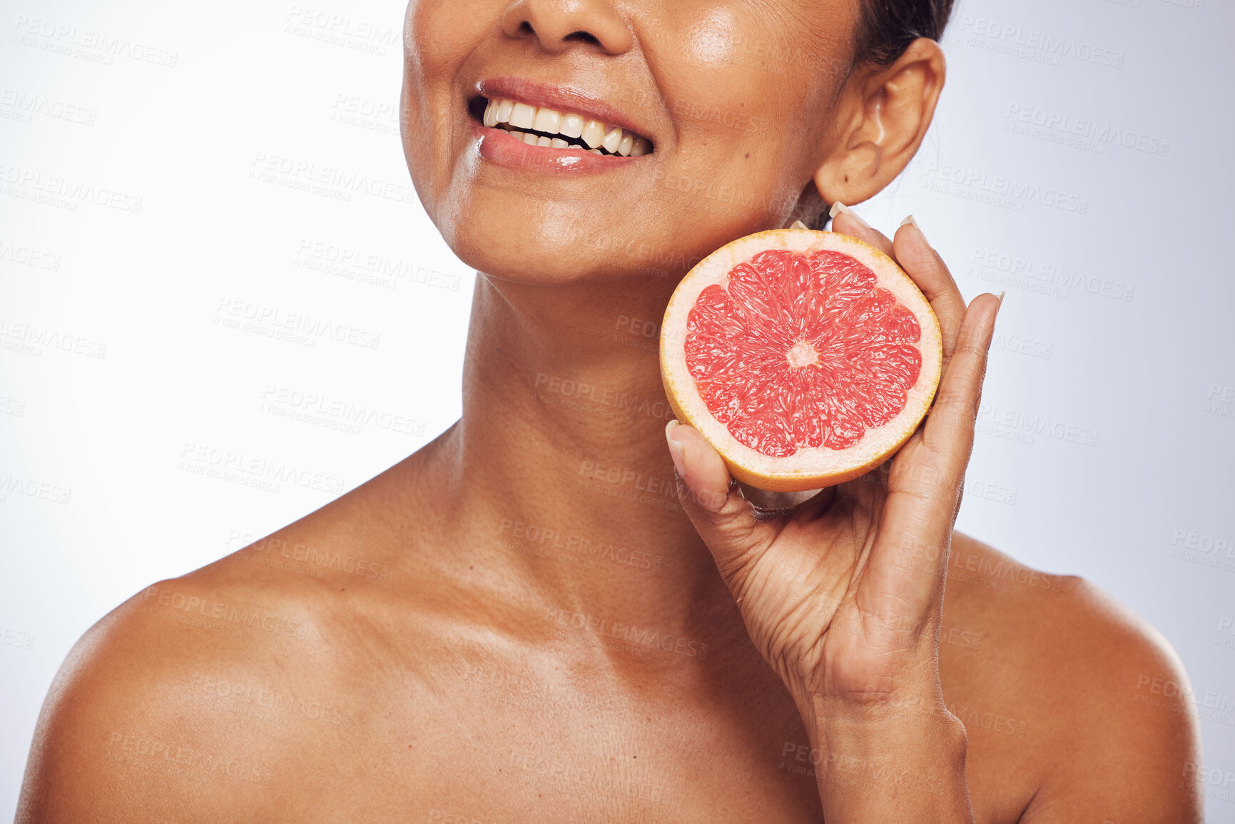 Buy stock photo Skincare, beauty and happy woman with grapefruit in studio isolated on a white background. Food, natural fruit and hand of model with nutrition for wellness, healthy diet and vitamin c for anti aging