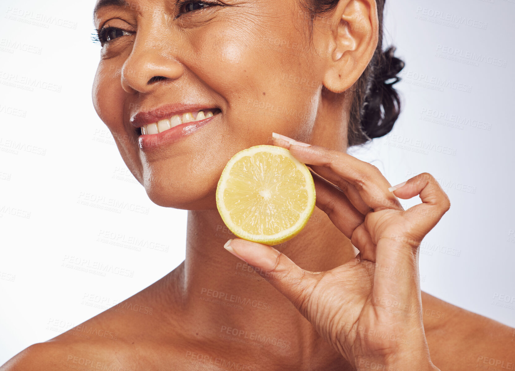 Buy stock photo Thinking, orange and senior woman with skincare, cosmetics and vitamin c against a white studio background. Mature female person, happy lady or model with citrus fruit, natural beauty and nutrition