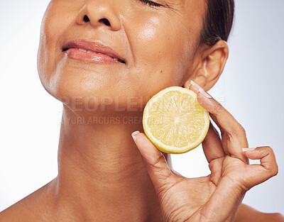 Buy stock photo Cosmetics, orange and senior woman with skincare, natural beauty and vitamin c on a white studio background. Mature female person, self care and model with citrus fruit, natural beauty and wellness