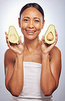 Portrait, skincare and senior woman with avocado in studio isolated on a white background. Face, natural fruit and happy model with food for vegan nutrition, healthy diet and omega 3 for anti aging.