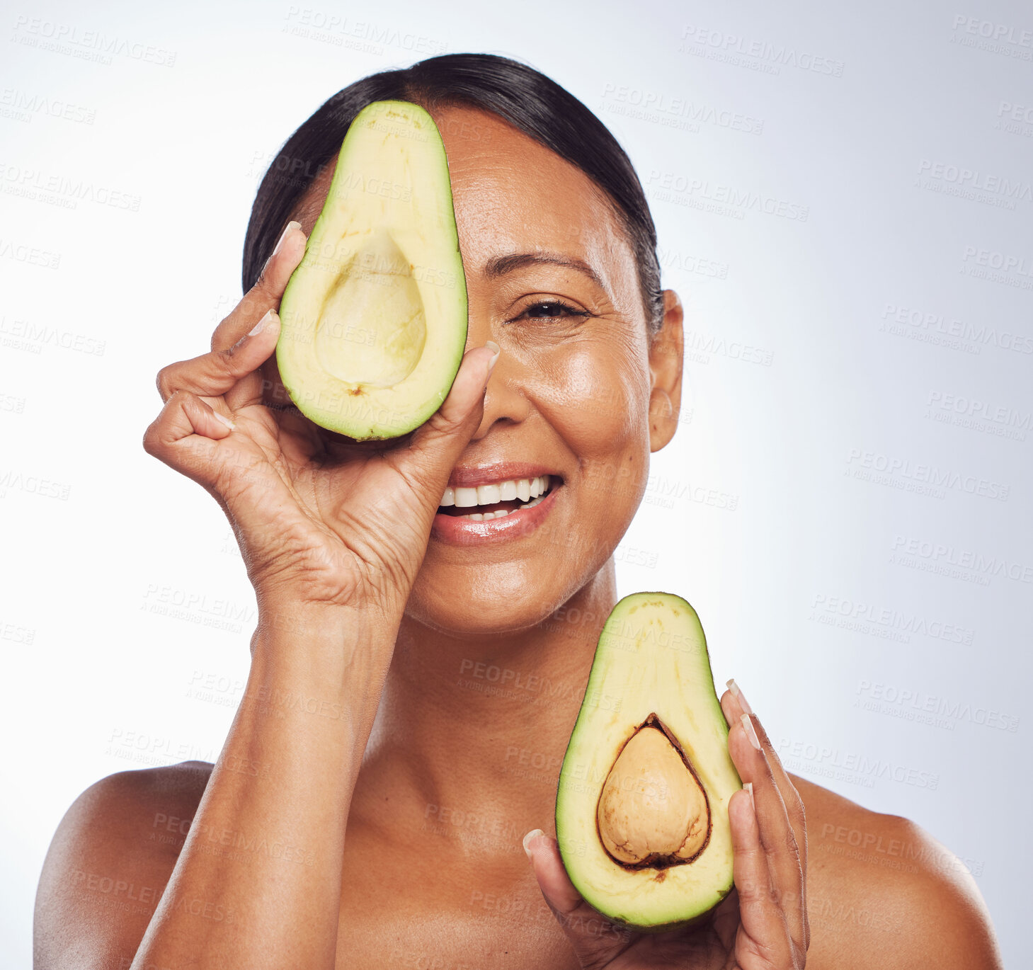 Buy stock photo Senior, anti aging and portrait of woman with avocado for skincare, nutrition or diet. Happy, face and elderly model or lady with food for wellness, beauty and detox isolated on a studio background