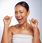 Dental, portrait or mature woman flossing teeth for beauty or wellness in studio on white background. Smile, self care or healthy senior model grooming or cleaning her tooth or mouth for hygiene 