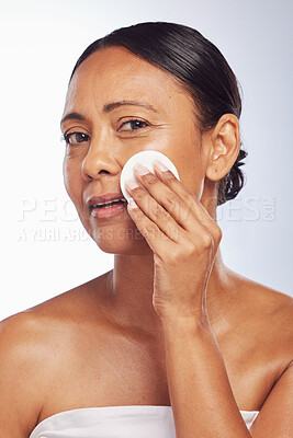 Buy stock photo Skincare, senior or woman portrait with cotton pad for dermatology, wellness or healthy facial skin. Studio background, glow or face of mature person with swab for beauty, cleansing or dirt removal