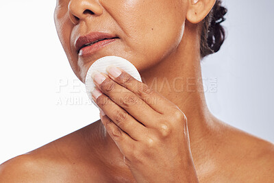 Buy stock photo Skincare, closeup or woman with cotton pad for dermatology, wellness or healthy facial skin. White background, hand or face of person cleaning with swab for beauty shine, cleansing or dirt removal