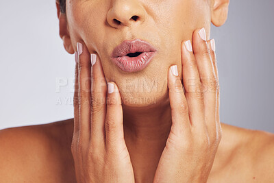 Buy stock photo Lips, pouting or hands of a woman for skincare, beauty or dermatology wellness. Mouth, anti aging and face or manicure of a model for cosmetic nails, glow or wow isolated on a studio background