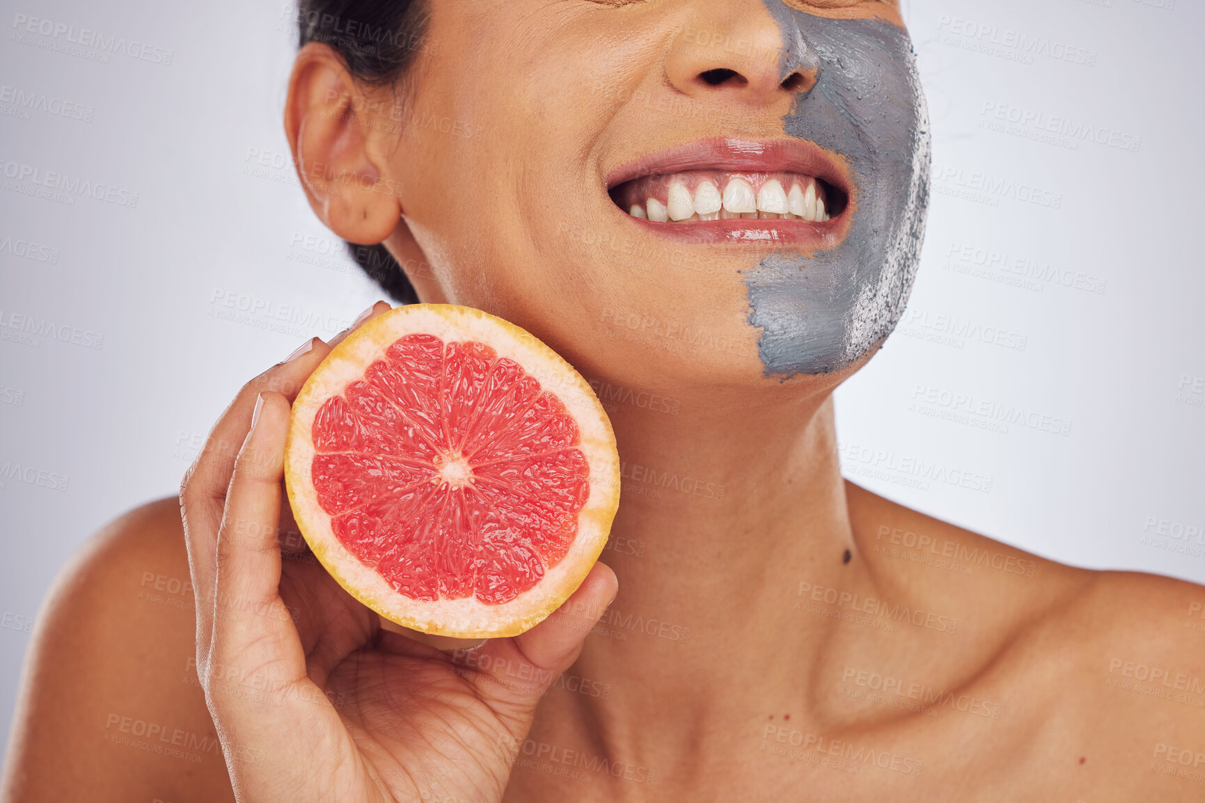 Buy stock photo Skincare, grapefruit and woman with a face mask with charcoal, clay or natural beauty product for wellness, detox or nutrition. Fruit, healthy cosmetics and girl happy with vitman c or facial care 