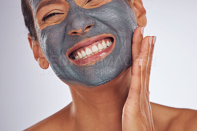 Buy stock photo Happy woman, charcoal mask and face for beauty on studio background. Mature female model smile with clay skincare product, facial cosmetics or aesthetic makeup for dermatology, collagen and self care