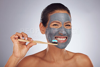 Buy stock photo Woman, brushing teeth and skincare portrait for dental, eco friendly product and charcoal face mask. Beauty, bamboo toothbrush and person or model facial and mouth cleaning on studio white background