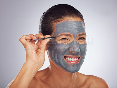 Buy stock photo Portrait, eyebrow tweezers and a woman with a face mask for skincare, grooming and female beauty. Sore, cosmetics and a model with gear for hair and a facial isolated on a white background in studio