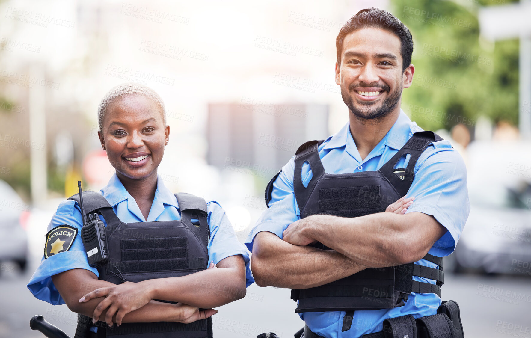 Buy stock photo Happy, portrait and police with arms crossed in the city for security, safety and justice on the street. Team, pride and a black woman and a man with confidence working in urban crime together