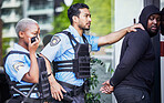 Police, arrest and criminal outdoor, justice and legal with power struggle, crime and walkie talkie. Officer, suspect in a street or professional law enforcement with a man, downtown, jail or service