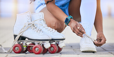 Hands, roller skates and tie shoes on street to start exercise, workout or training outdoor. Skating, person and tying sneakers to get ready for sports on road to travel, journey and fitness practice