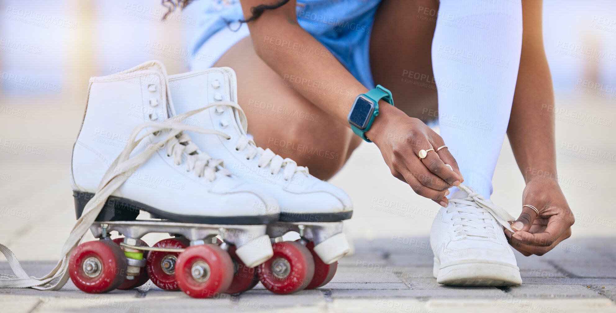 Buy stock photo Hands, roller skates and tie shoes on street to start exercise, workout or training outdoor. Skating, person and tying sneakers to get ready for sports on road to travel, journey and fitness practice