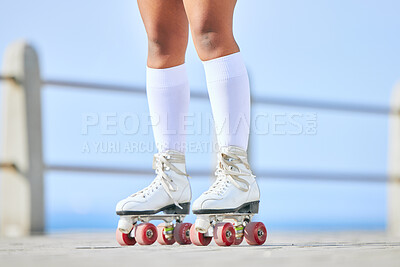 Legs, roller skates and shoes on street for exercise, workout or training outdoor. Skating, feet of person and sports on road to travel, journey and moving for freedom, hobby and fitness practice.