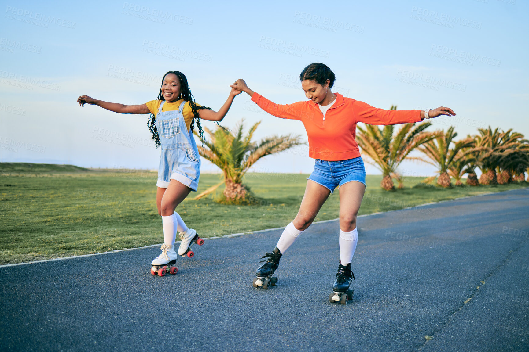 Buy stock photo Roller skates, holding hands and friends on street for workout, exercise or training outdoor. Skating, happy people and girls together for sports on road to travel, journey and moving for fitness.