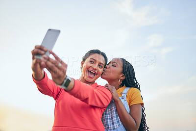 Buy stock photo Selfie, kiss and friends posing together outdoor during summer to update a profile picture or status. Photograph, love and bonding with excited young women posting to social media while in nature