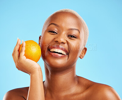 Buy stock photo Orange, portrait and black woman with skincare, natural beauty and dermatology on a blue studio background. Female person, face detox or model with citrus fruit, cosmetics and wellness with vitamin c