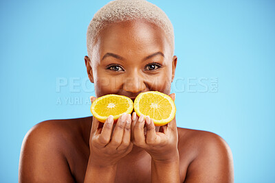 Buy stock photo Portrait, beauty and fruit with a model black woman in studio on a blue background for natural wellness. Face, skincare and orange with a happy young female person holding a fresh snack for health