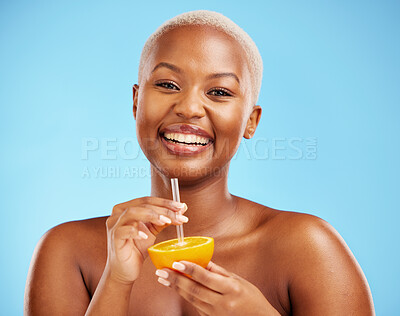 Buy stock photo Happy black woman, portrait and orange for vitamin C, diet or natural nutrition against a blue studio background. African female person smile with citrus fruit and straw for healthy wellness or juice