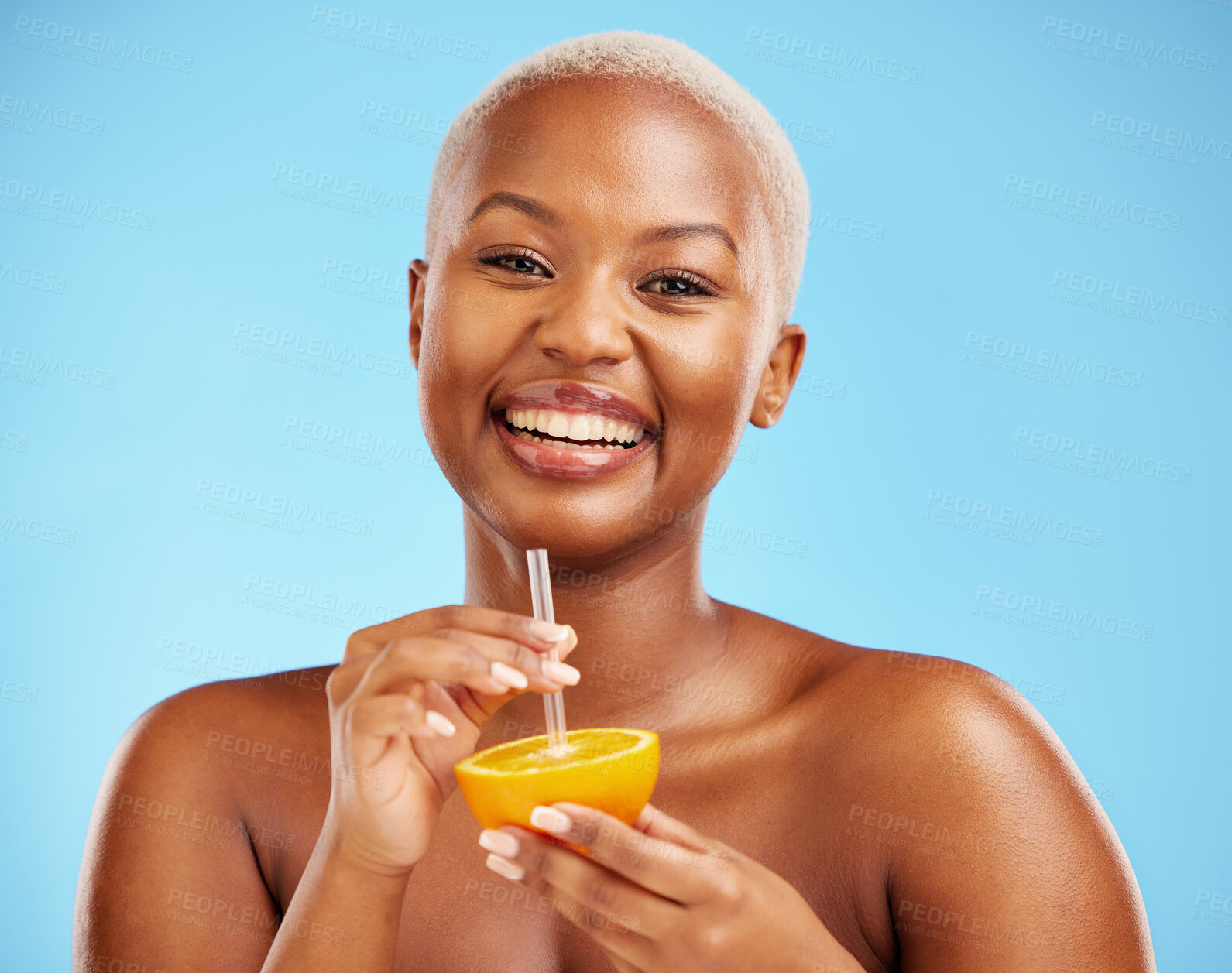 Buy stock photo Happy black woman, portrait and orange for vitamin C, diet or natural nutrition against a blue studio background. African female person smile with citrus fruit and straw for healthy wellness or juice