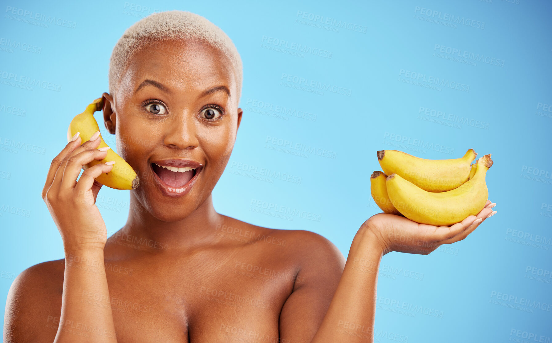 Buy stock photo Happy black woman, banana and diet for potassium, vitamin or fiber against a blue studio background. Portrait of African female person with bunch of yellow fruit for health and wellness on mockup