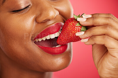 Buy stock photo Strawberry, lipstick and woman lips eating, eco friendly product and color choice or dermatology. Happy mouth of african person or model with skincare, fruit and vegan makeup on studio red background