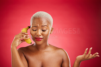 Buy stock photo Beauty, woman and talking to a banana phone or acting, pretending and fake call or conversation on red background. Playful communication, studio and portrait of girl with fruit or crazy chat