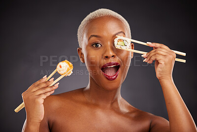 Buy stock photo Sushi, portrait and woman with chopsticks in studio for healthy eating, beauty and food. Face of excited black person with makeup on a dark background for wellness, diet or wow seafood advertising