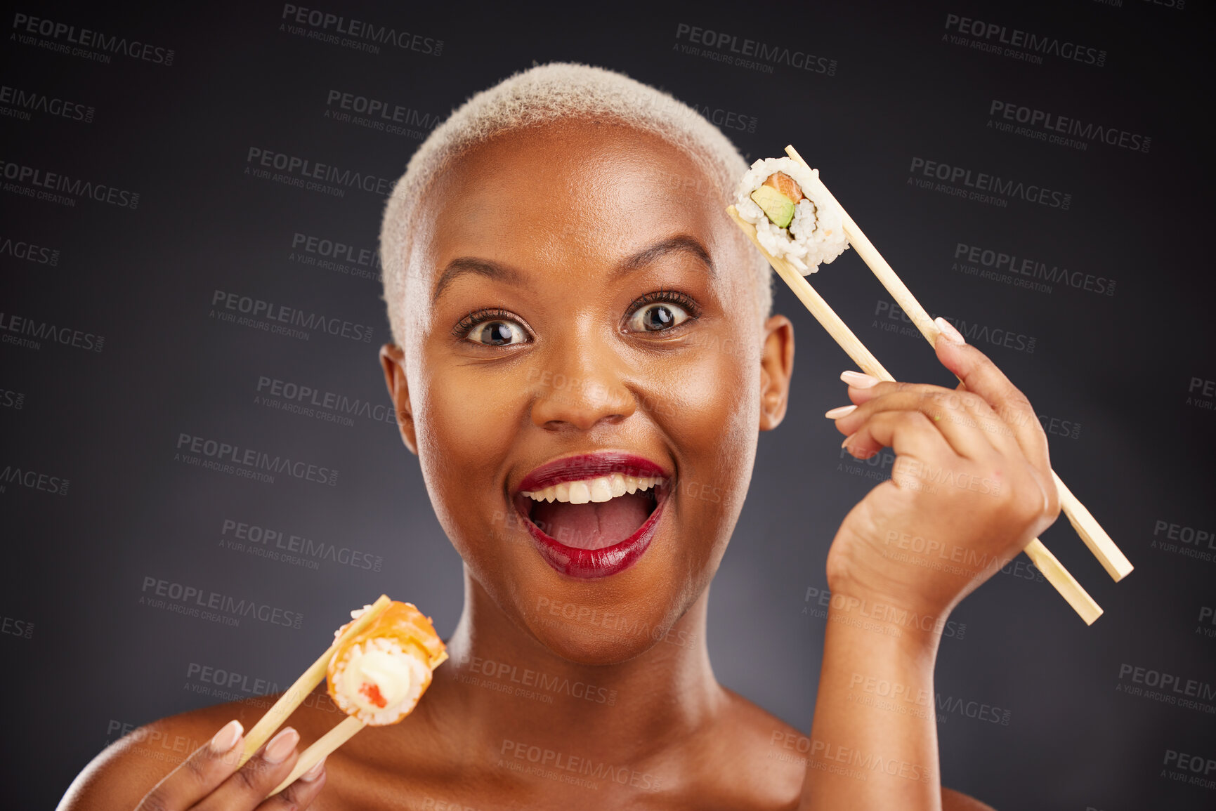 Buy stock photo Woman, portrait and sushi surprise with chopsticks in studio for healthy eating, beauty and food. Face of a happy black person with makeup on a dark background for diet, wow or seafood advertising