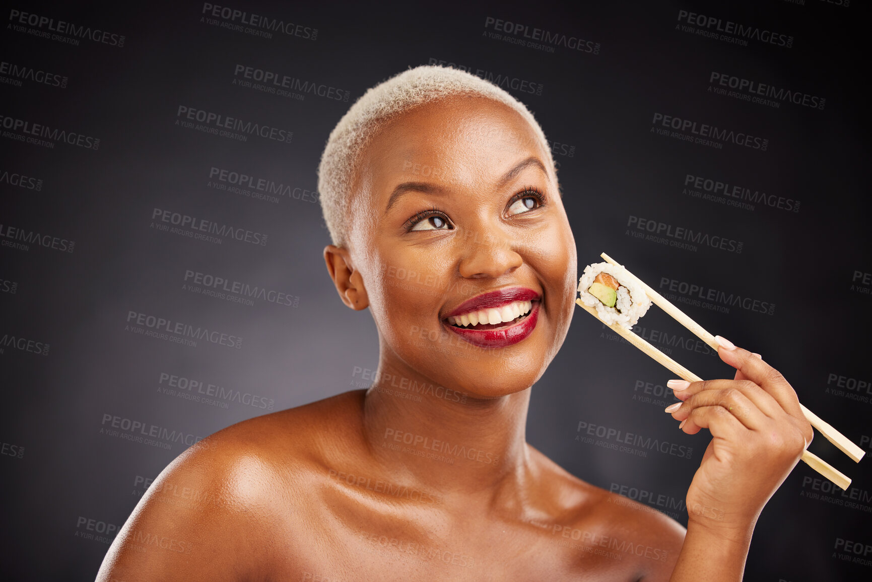 Buy stock photo Thinking, face and woman with sushi and chopsticks in studio for healthy eating, beauty or food. Happy black female model with makeup idea on dark background for wellness, diet or seafood advertising