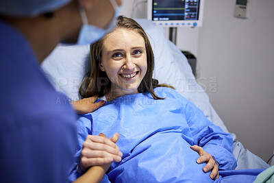 Buy stock photo Pregnant woman, labor and hospital with holding hands, bed and support from nurse, excited smile and pain. Strong mother, midwife and helping hand in clinic for infant child, motivation and new life