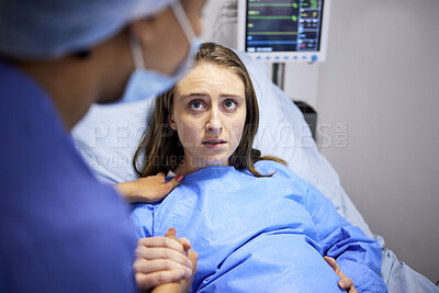 Buy stock photo Pregnant woman, hospital and labor with push, holding hands or midwife at bed, baby and talking. Strong mother, childbirth and nurse with helping hand, advice and care for healthy delivery in clinic