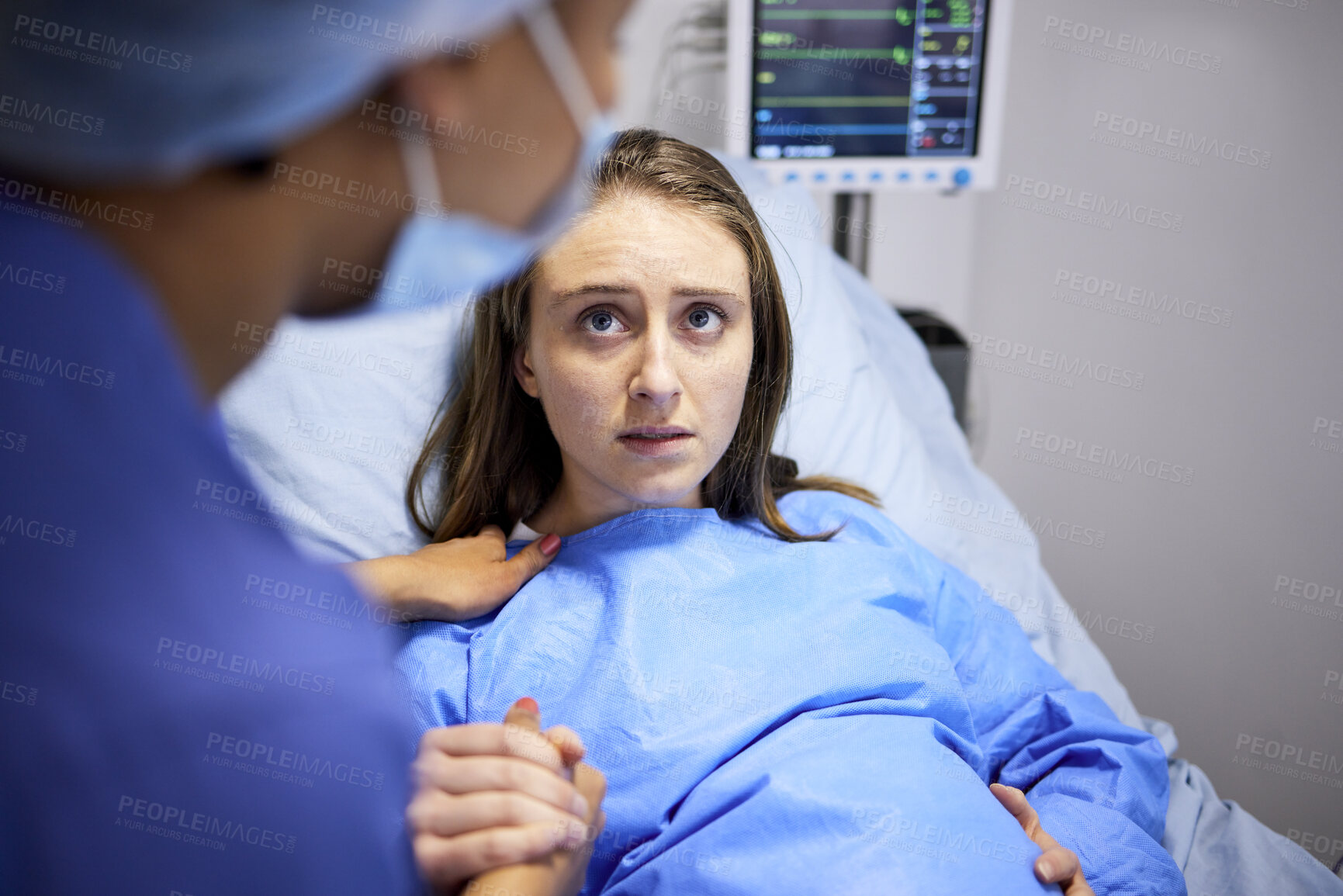 Buy stock photo Pregnant woman, hospital and labor with push, holding hands or midwife at bed, baby and talking. Strong mother, childbirth and nurse with helping hand, advice and care for healthy delivery in clinic