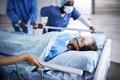 Buy stock photo Hospital, bed and patient with doctors running in surgery, emergency and support for healthcare service. Theatre, surgeon and sick child with medical people or nurses in speed for crisis and problem