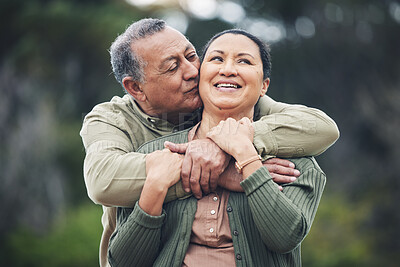 Buy stock photo Hug, kiss and senior couple in nature, thinking and love during retirement together. Happy, idea and an elderly man and woman with affection in a garden or park for support or care in marriage
