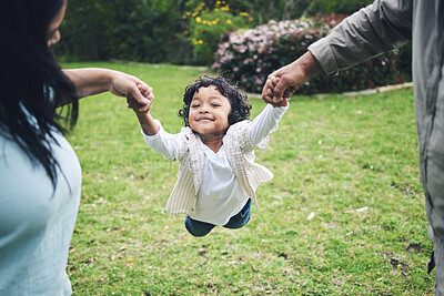 Buy stock photo Kid, parents and holding hands in garden for fun in outdoor for bonding with game in portrait. Happy, father and mother with spinning in park and freedom or family in summer with flying with trust.
