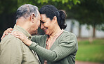 Love, affection and senior couple in nature in an outdoor park with care, happiness and romance. Happy, smile and elderly man and woman in retirement embracing and bonding together in a green garden.