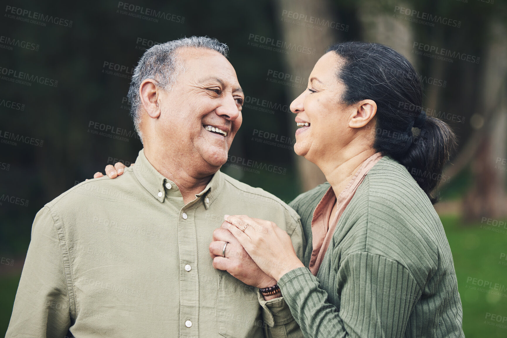 Buy stock photo Love, talk and mature couple in nature in an outdoor park with care, happiness and romance. Happy, smile and senior man and woman in retirement embracing and bonding together in a green garden.