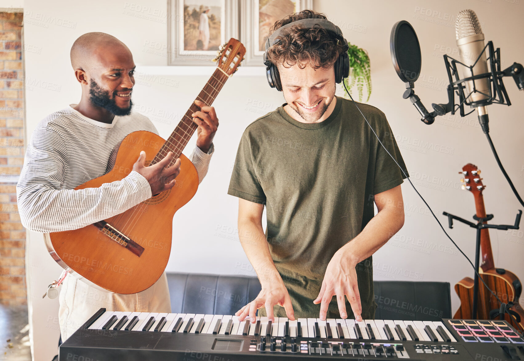 Buy stock photo Happy, piano and friends with guitar recording music in home studio together. Electric keyboard, acoustic instrument or microphone of singer in band, headphones and team of men in production of sound