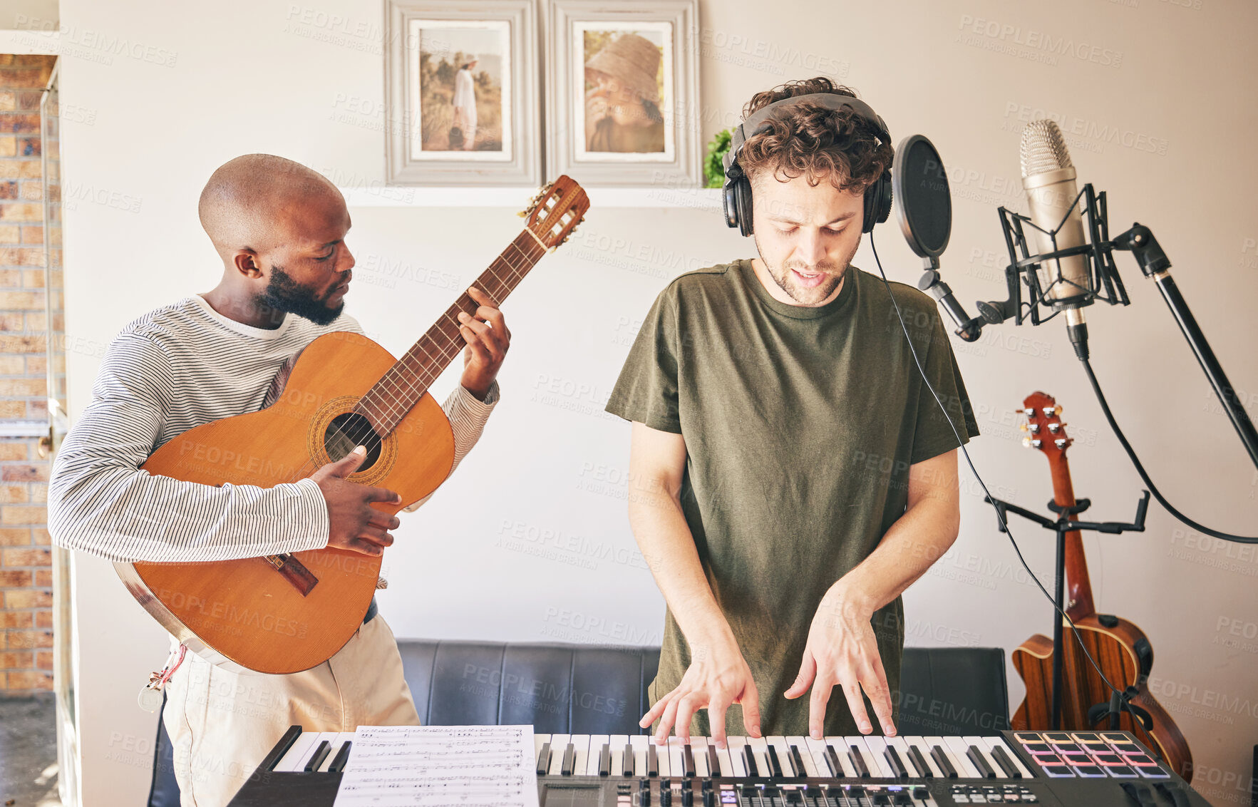 Buy stock photo Music, piano and friends with guitar recording in home studio together. Electric keyboard, instrument and microphone of singer with teamwork, creative men and artists in production of acoustic sound
