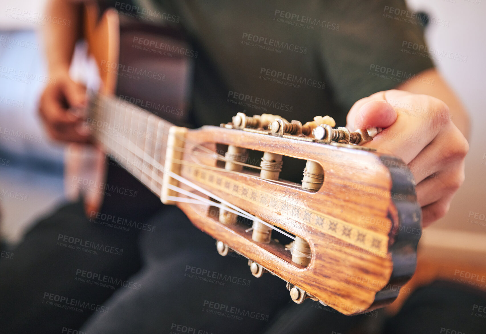 Buy stock photo Hands, person and tuning guitar for music, talent and creative skill in sound production. Closeup, musician and singer check notes of acoustic instrument for audio performance, solo artist or concert