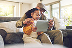 Young girl, grandfather and tablet, games and entertainment, watch cartoon or e learning while at home. Bonding, love and spending quality time, old man and female child with gadget and internet