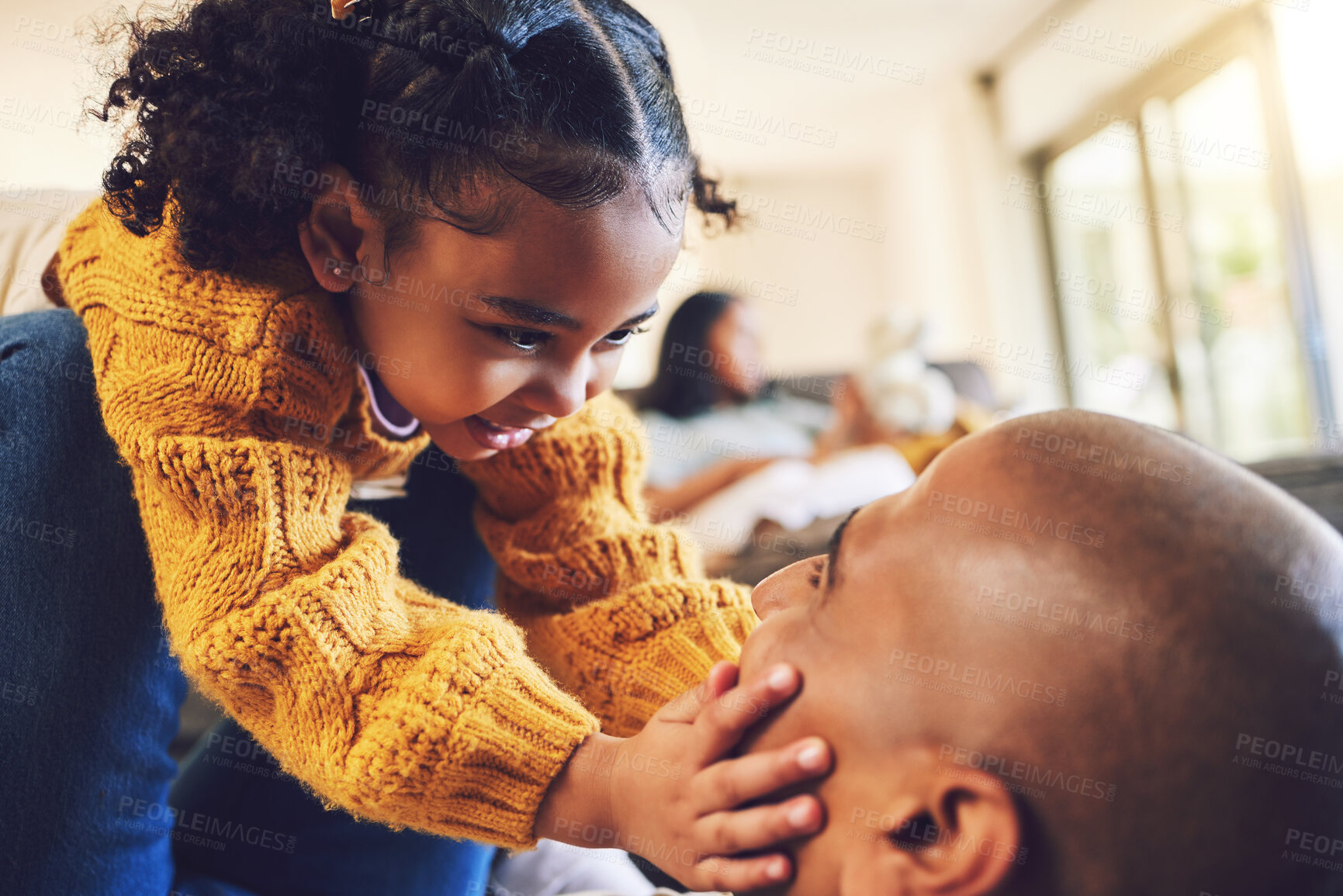 Buy stock photo Happy father, girl and touch face in home living room, bonding and having fun together. Smile, dad and child play with cheeks, family and kid with care, love and enjoy quality time to relax in house.