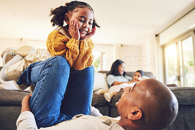 Buy stock photo Happy father, girl and play in home living room, bonding and having fun together. Smile, dad and child on knee of parent, kid and family with care, love and enjoying quality time to relax in house.