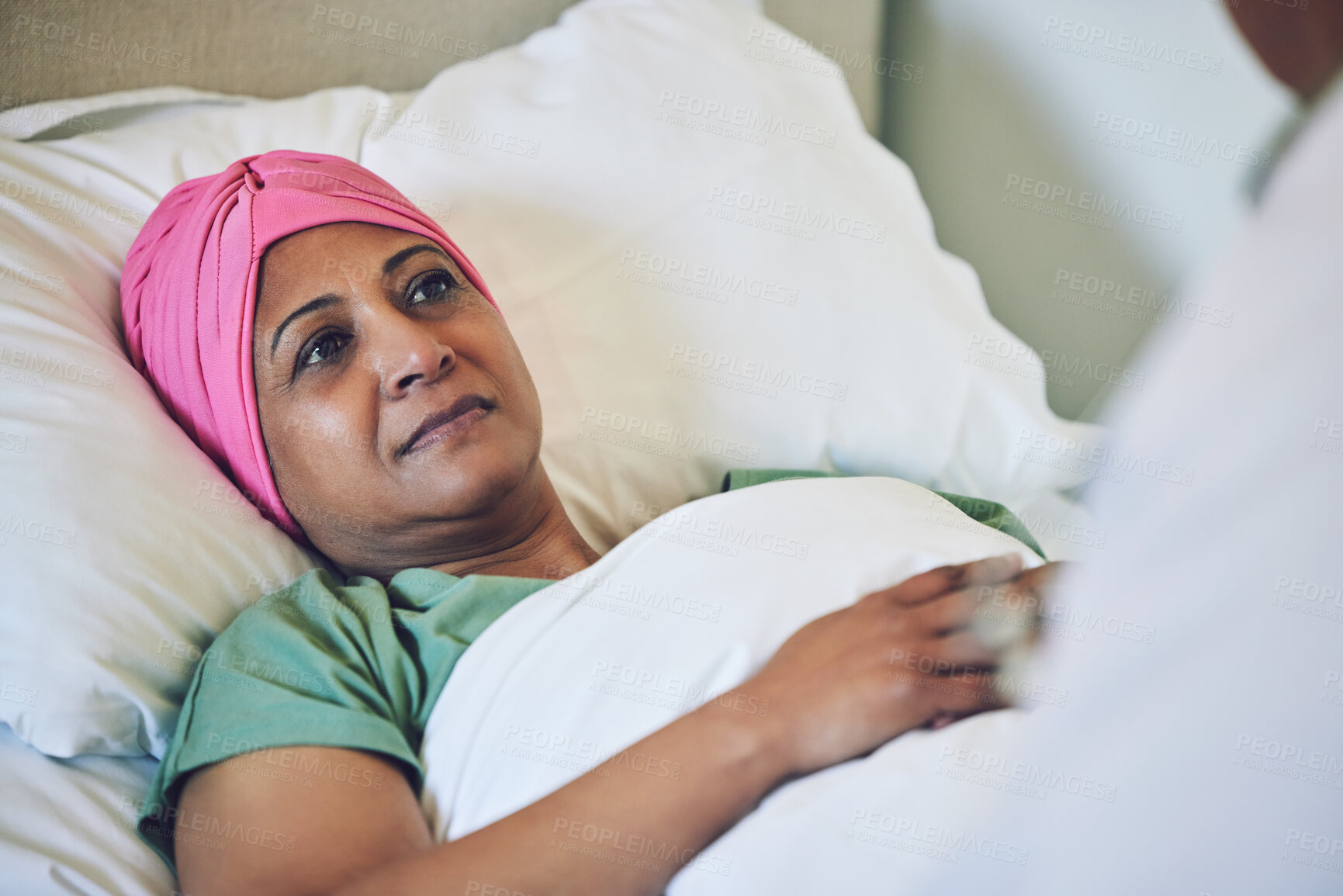 Buy stock photo Medical, healthcare and cancer with muslim woman in bed at hospital for treatment or recovery. Islam, medicine or sad person in hospice with a sick or tired mature patient in clinic for chemotherapy
