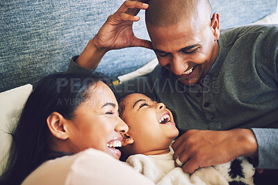 Buy stock photo Home, family and parents relax, funny and happiness with quality time, bonding and loving together. Mother, father and female child laughing, humor and calm on a weekend break, care and kid with joy
