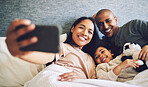 Family selfie, parents and child in a bed together with love, care and security or comfort. Woman, man and kid relax with a happy smile for quality time, memory or profile picture in a home bedroom