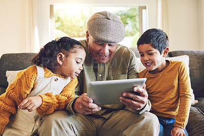 Buy stock photo Young kids, grandfather and tablet, relax together and watch cartoon or e learning with games while at home. Bonding, love and spending quality time, old man and grandkids with gadget and internet