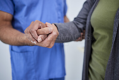 Buy stock photo Closeup, hands and doctor with a patient, support and solidarity with treatment, comfort and empathy. Zoom, medical professional and woman with test results, healthcare and help with hope and trust